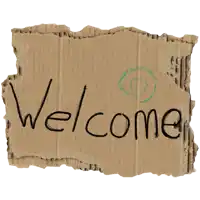 a piece of cardboard that says welcome on it