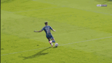 a soccer game is being played in front of a banner that says intersport
