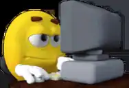 a yellow smiley face is sitting in front of a computer