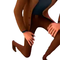 a man in a suit is kneeling down with his hands on his knees