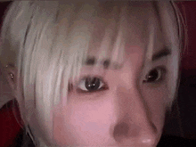 a close up of a person 's face with their eyes closed .