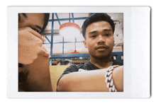 a man with a bracelet on his wrist is sitting next to a woman
