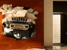 a jeep is smashed into a wall in a living room