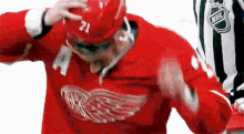 Detroit Red Wings Dylan Larkin GIF - Detroit Red Wings Dylan Larkin Throws Helmet GIFs