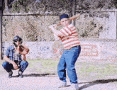 a boy is swinging a bat in front of a sign that says next left