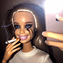 a barbie doll is smoking a cigarette and taking a selfie with her phone