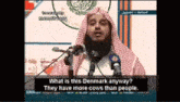 a man speaking into a microphone with the words " what is this denmark anyway "