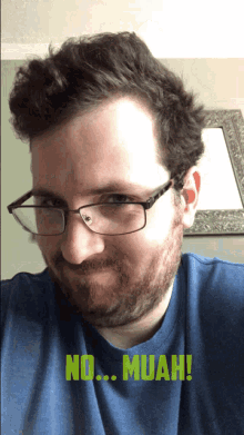 a man wearing glasses and a blue shirt says " no muah " in green