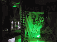 a green light is shining on a picture of a shiva holding a trident