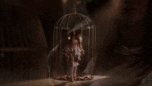 a close up of a metal object with smoke coming out of it in a dark room