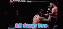 two men are fighting in a ring with the words lb owns you on the bottom