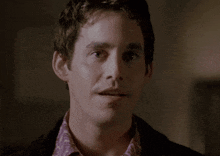 a man says " yeah looks like " in front of a dark background