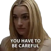 a woman with blonde hair has the words you have to be careful written on her face