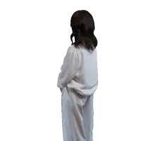a woman in a white shirt and white pants is making a funny face