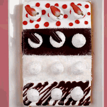 a cake with strawberries and whipped cream on it