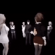 a group of anime characters are standing next to each other in the dark .