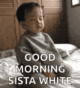 a baby is sitting on a bed with his eyes closed and the words good morning sista white above him