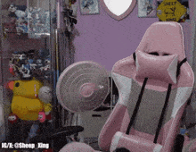 a sheep xing sign hangs above a pink chair