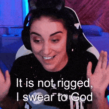a woman wearing headphones with the words it is not rigged i swear to god