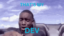 a man in a car with the words that 's my dev written on the bottom