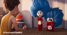 a poster for the cat in the hat shows a boy talking to two blue haired characters