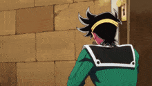 a cartoon character in a green jacket stands in front of a brick wall