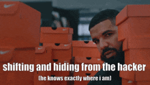 a stack of orange nike boxes with the words shifting and hiding from the hacker ( he knows exactly where i am )