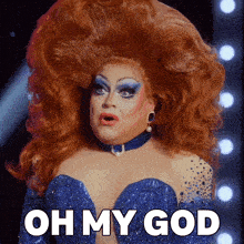 a drag queen says oh my god while wearing a blue outfit