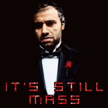 a man in a tuxedo with the words it 's still mass written in red