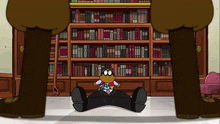 a cartoon character sitting on the floor in front of a bookshelf