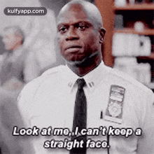 a man in a suit and tie is saying `` look at me , i can t keep a straight face '' .