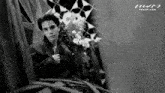 a black and white photo of a man with the website praew.com in the bottom right corner