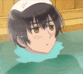 a boy with a white towel on his head is taking a bath