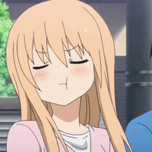 a girl with blonde hair is making a funny face