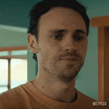 a close up of a man 's face with netflix written on the bottom