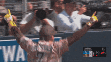 uc san diego health is displayed on the screen behind a baseball player