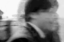 a black and white photo of a man 's face .