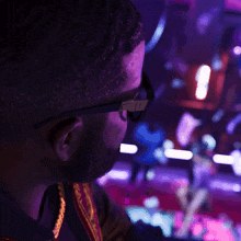 a man wearing glasses has the number 11 on his glasses