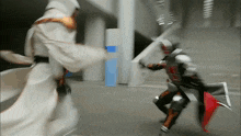 a man in a white robe is holding a sword and shield while another man in armor is holding a sword
