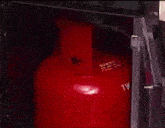 a propane and butane gas cylinder in a box