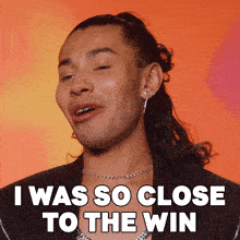 a close up of a man 's face with a caption that says i was so close to the win