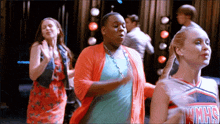 a cheerleader wearing a winnrs jersey is dancing
