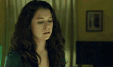 a woman with her eyes closed and a bite in her mouth