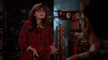 a woman in a plaid shirt says i ve got it