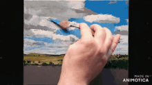 a person is painting a landscape with the words made in animotica below them