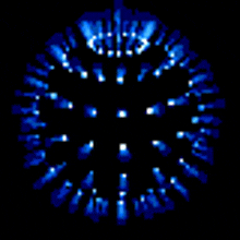 a blue firework display in the dark with a crown on top