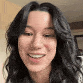 a close up of a woman 's face with a smile on her face