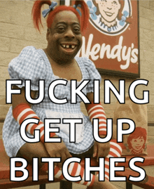 a wendy 's sign is behind a woman in a dress