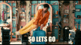 a man in a barber shop with the words so lets go written on the bottom