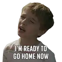 a young boy with his eyes closed and the words " i 'm ready to go home now " on his face